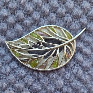 Elegant Silver Tone Leaf Brooch with Green Accents